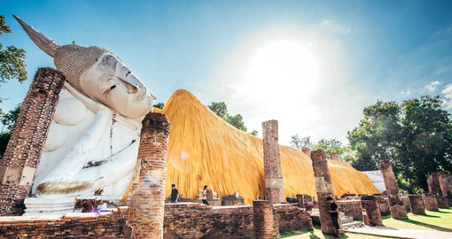 Visit the Buddha statue at temple of Ayutthaya as part of your Thailand Vacation.