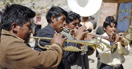 Aymara musicians play their trumpets at the festival Morenada