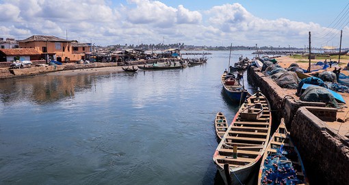 Stroll along the portside of Elmina, a town known for its fishing and trade