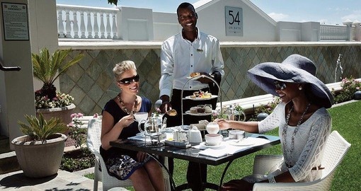 Dine on the terrace at 54 On Bath during your South African trip.