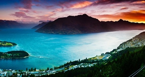 Experience breathtaking Aerial view of Queenstown with Lake Wakatipu at Dusk during your next trip to New Zealand.