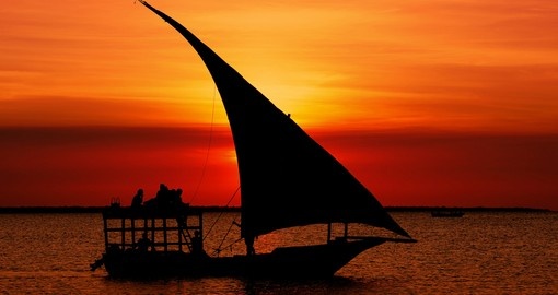 Travel to Mozambique and see the fishermen dhow at sunset