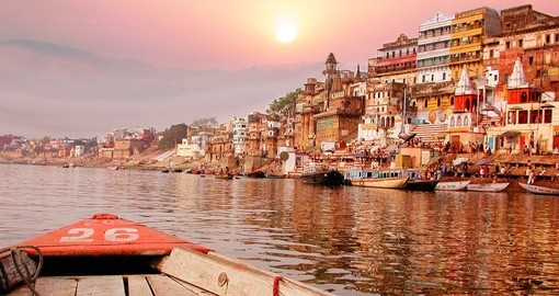 Sunsets over the river bank on the Ganges River is an ideal photo opportunity on India tours.