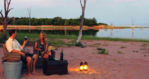 Dine on the beach at Lake Kariba during your travel to Zimbabwe