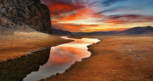 A Mongolian desert sunrise a highlight of many Mongolia tours.