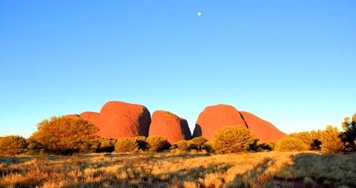 Enjoy the beautiful Olgas at sunset during your trip to Australia.