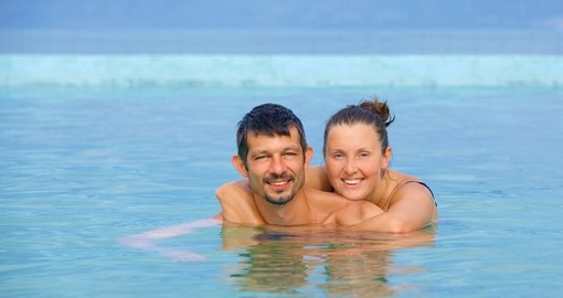 Relaxing couple in a geothermal mineral pool