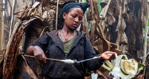 Dorze ethnic woman making thread for weaving