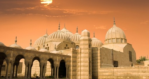 Arabic domes at sunset in Cairo make for a great photo while on your Egypt vacation.