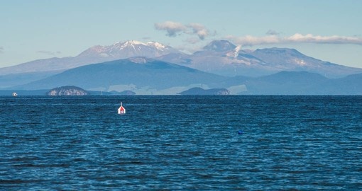 See Tongariro National Park from Lake Taupo on your New Zealand vacation package