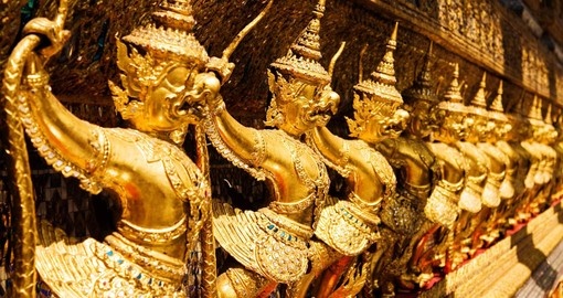 Golden Garuda sculptures at the Royal Palace