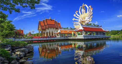Learn about traditional Thai religions at the Wat Plai Laem Temple  on your trip to Thailand