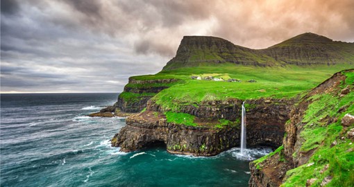 Discover Gasadalur village and its iconic waterfall on your Faroe Island Tour