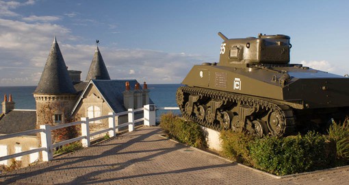 A preserved Sherman tank overlooks the Normandy coast at Arromanches-les-Bains