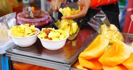 Enjoy delicious street food at a market in Bangkok on your Thailand Vacation