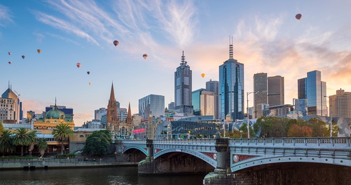 Melbourne skyline at twilight along river