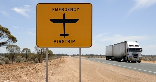 Emergency airstrip sign with road train