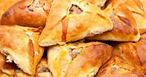 Traditional tatar potato and meat stuffed baked pastry isolated