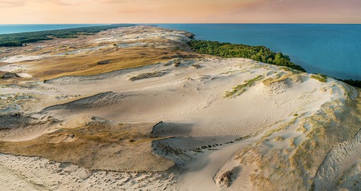 Explore the desert landscape of the Curonian Spit that lies at the north end of Lithuania