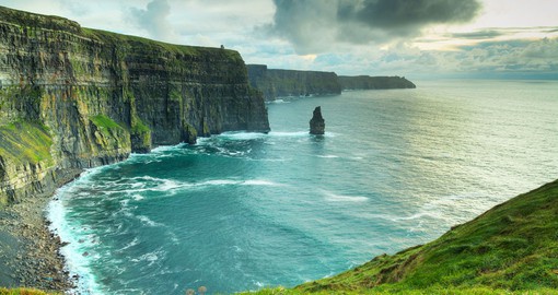 Enjoy the breathtaking view of the magnificent Cliffs of Moher at sunset