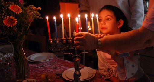 Lighting a candle for Jewish holiday of Hanukkah