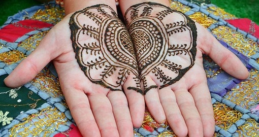 A henna tattoo on womans hands