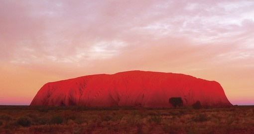 Experience sunrise at Ayers Rock as part of your Australia Vacation