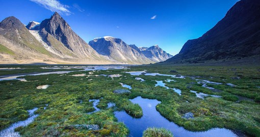 The Akshayuk Pass is a stunning valley surrounded by the southern Baffin Mountains in Nunavut
