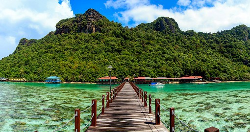 Explore the lush forests and sandy beaches of Bohey Dulang Island
