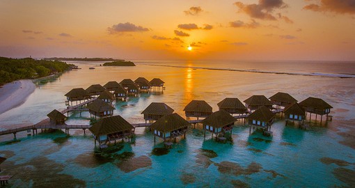 Relax on a jetty in the Maldives to view the perfect sunset