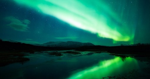 Glowing green Northern Lights - an amazing experience to see on all Finland vacations.