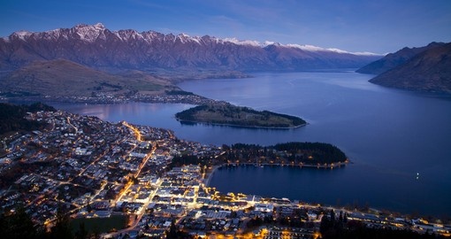 Enjoy beautiful Aerial view of Queenstown at dusk during your next trip to New Zealand.