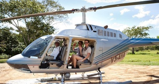 Take a helicopter to your resort on your Belize vacation