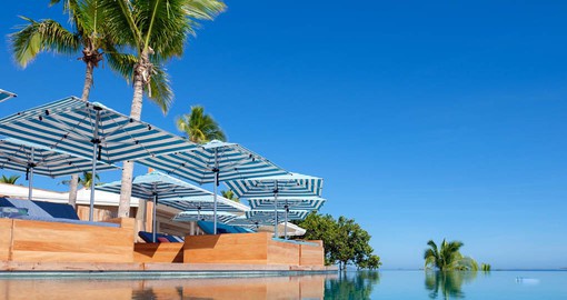Enjoy a relaxing day by the pool at the Malamala Beach Club on your Fiji vacation