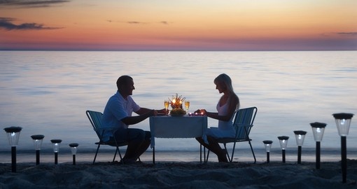Romantic dinner on the sea sand beach
