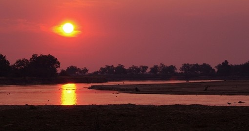 View the sunset off the Luangwa River on your Zambia tour