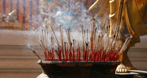 Burning incense sticks at a Buddhist temple