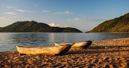 Watch the sun rise against the calming blue waters of Lake Malawi, the third largest freshwater lake in the world