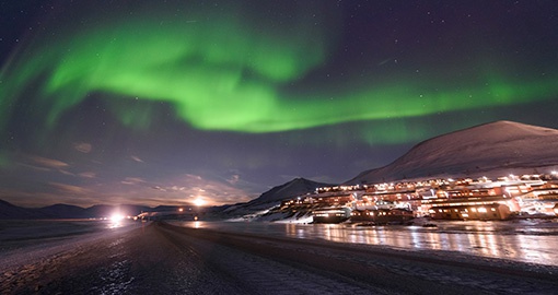 The polar aurora Northern lights in the mountains near Spitsbergen