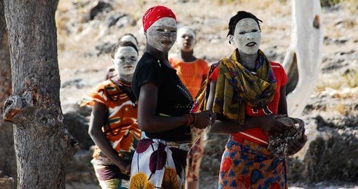 Makua women with traditional white face mask