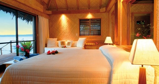 Relax at night in your own over water bundalow at the Aitutaki Lagoon Resort on a Cook Island Vacation Packages