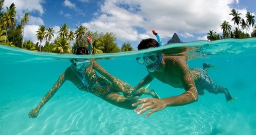 Enjoy snorkeling in the crystal clear waters of Bora Bora on your next Trip to Tahiti.