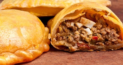 Empanada is a pastry turnover filled with_a variety of savory ingredients