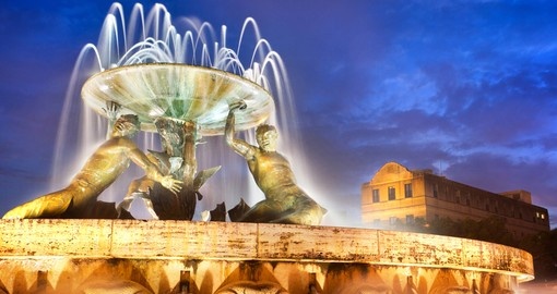 The Triton Fountain - always a popular photo stop on all Malta vacations.