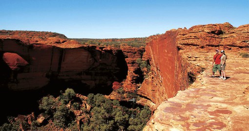 The crimson walls of Kings Canyon are over 100 metres high are an inspiring addition to your trip to Australia