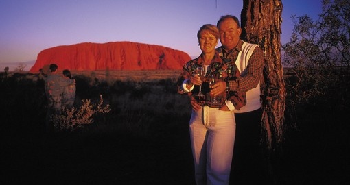 Stare up at the stars and gaze off into the distance at Uluru at night during your Australia Vacation