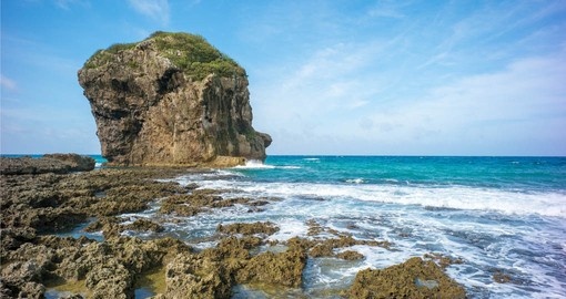 Kenting has a beautiful landscape with areas such as Chuanfan Rock a must see during your Taiwan Tours.