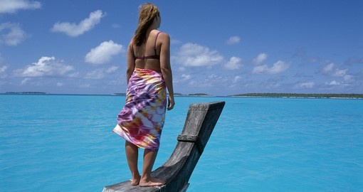Woman standing on boat in Aitutaki, Cook Islands
