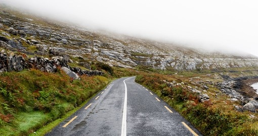 Road disappearing into the mist on the Wild Atlantic Way in Ireland