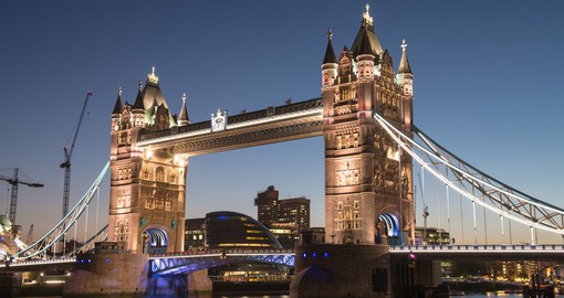 Cross the magnificent Tower Bridge, best enjoyed at night, on you London Vacation